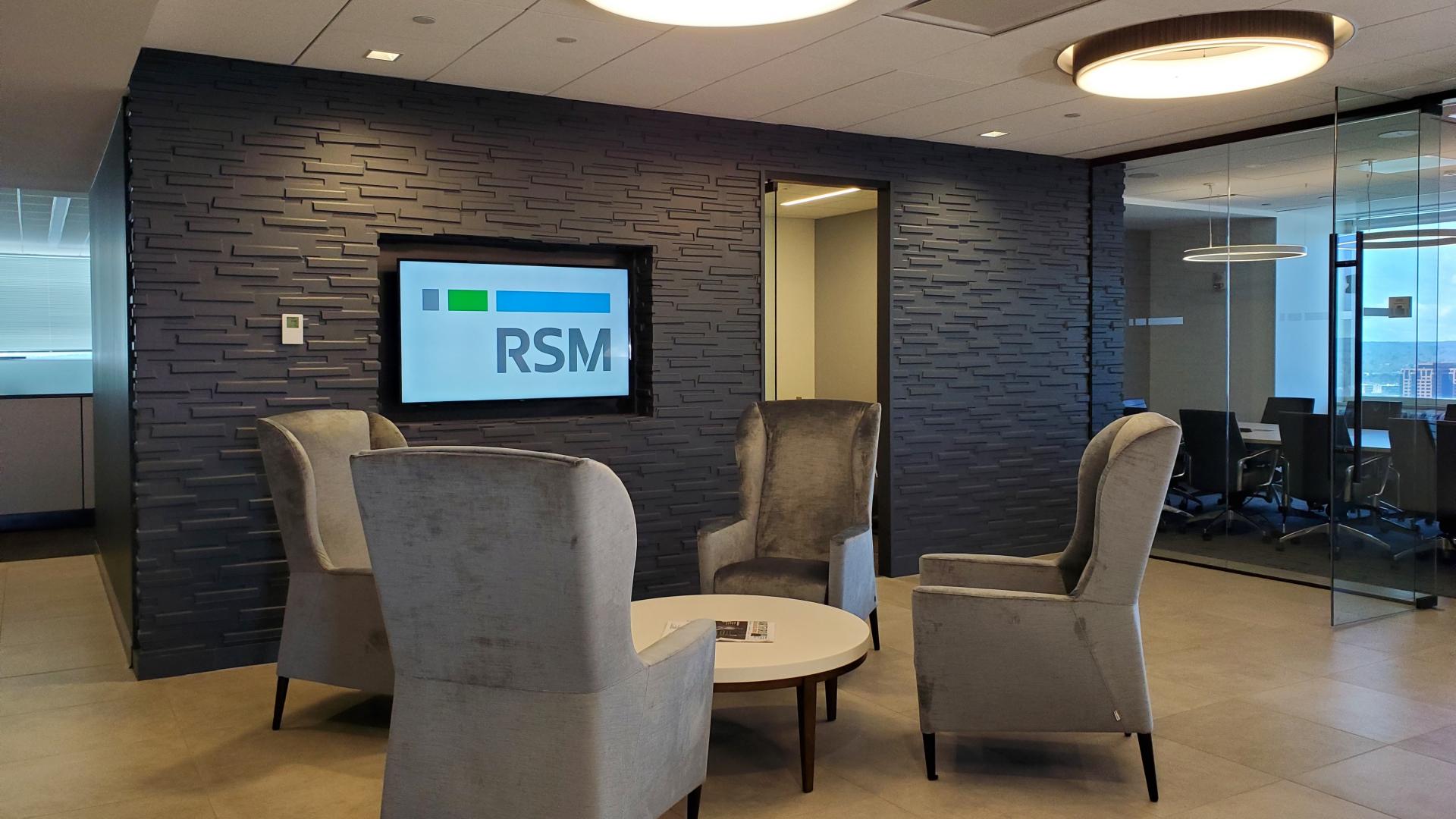 Informal soft seating area with comfortable high back club chairs is perfect for waiting or a casual meeting